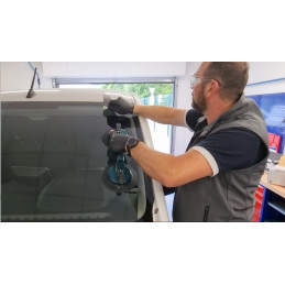 Applying adhesive tape during windshield installation at VBSA France